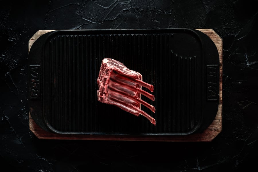 French-trimmed rack of lamb on a cast-iron griddle