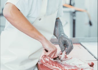 Meat being portioned on the band saw