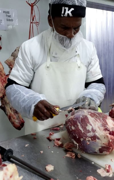 Butcher deboning beef on the Kalahari cutting line